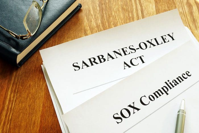 Sarbanes-Oxley Act and SOX compliance policy on table.