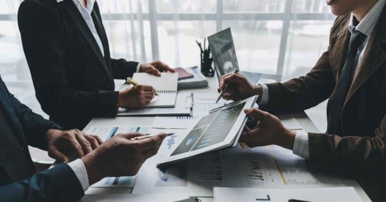 Meeting of the business team To analyze and discuss the situation in financial reports in the conference room. investment consultant financial advisor and accounting concepts.