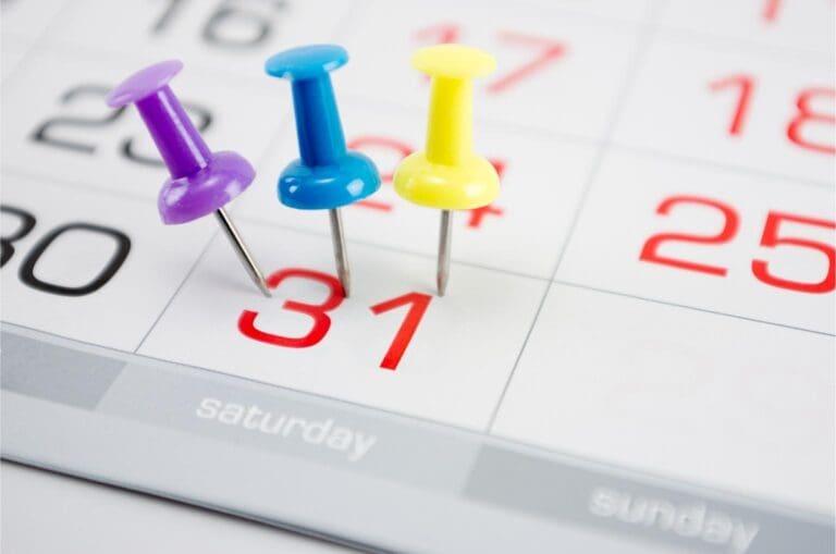 calendar with 3 thumbtacks on date 31