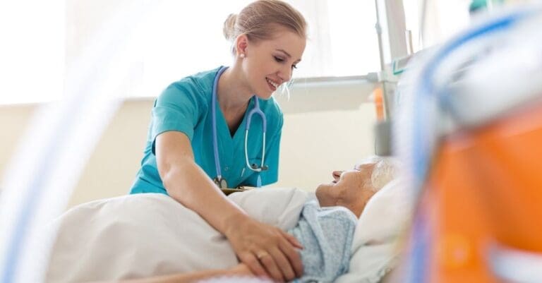 Nurse tending to an elderly woman