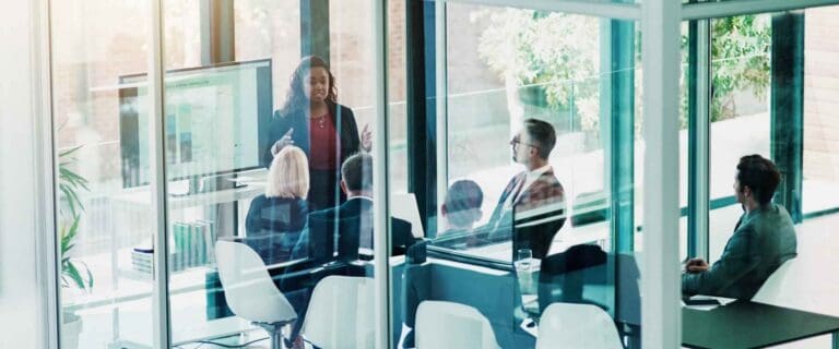 Executive team in a conference room during a presentation